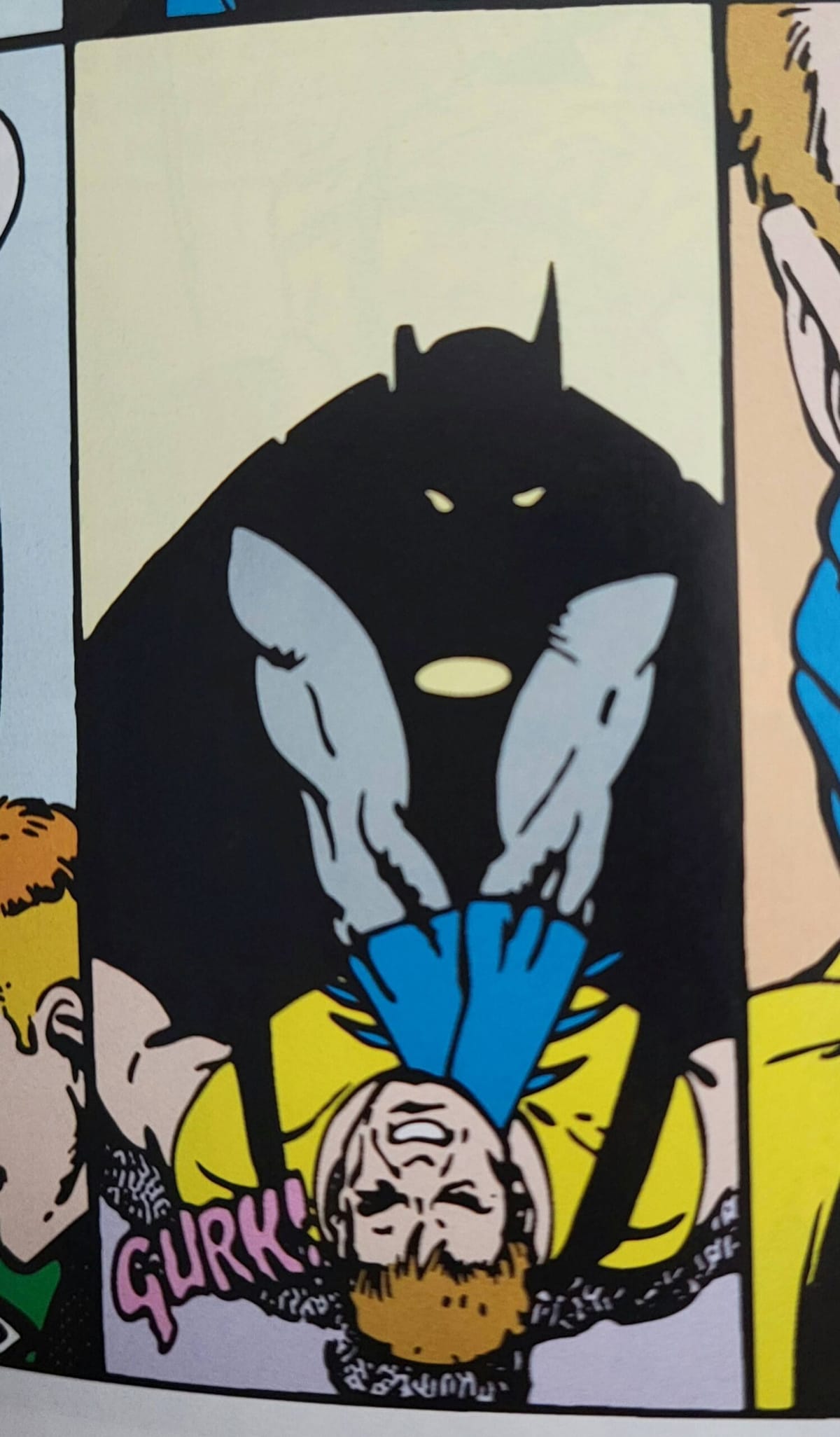 Batman, shown in silhouette, chokes Rick Flagg.