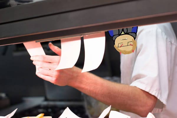 A stock photo of an unseen person reaching out to take an order down from the rail in a commercial kitchen. A cartoon version